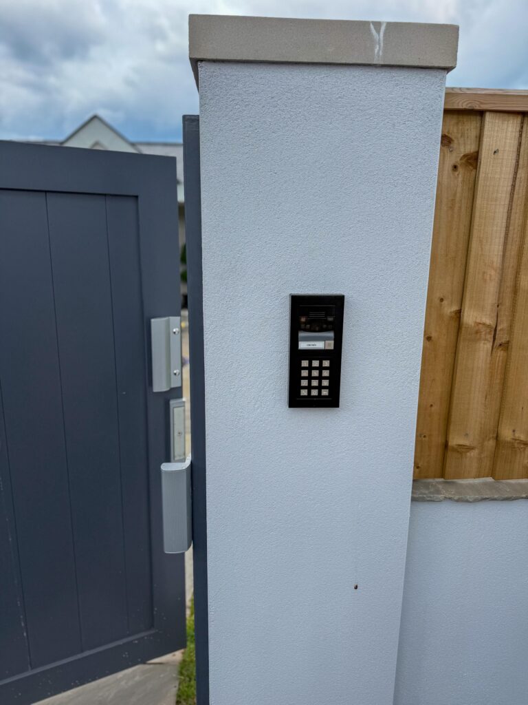 Door entry keypad on a gate pillar