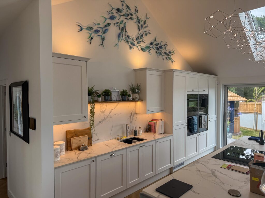 Kitchen with integrated appliances and under-cabinet lighting